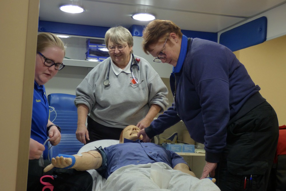 Paramedic students Destiny Hatfield, left, and Lyn Garison, right, work through a simulated emergency medical scenario as teacher Sr. Kathy Limber looks on at Southwest Virginia Community College in Cedar Bluff. (Provided photo)