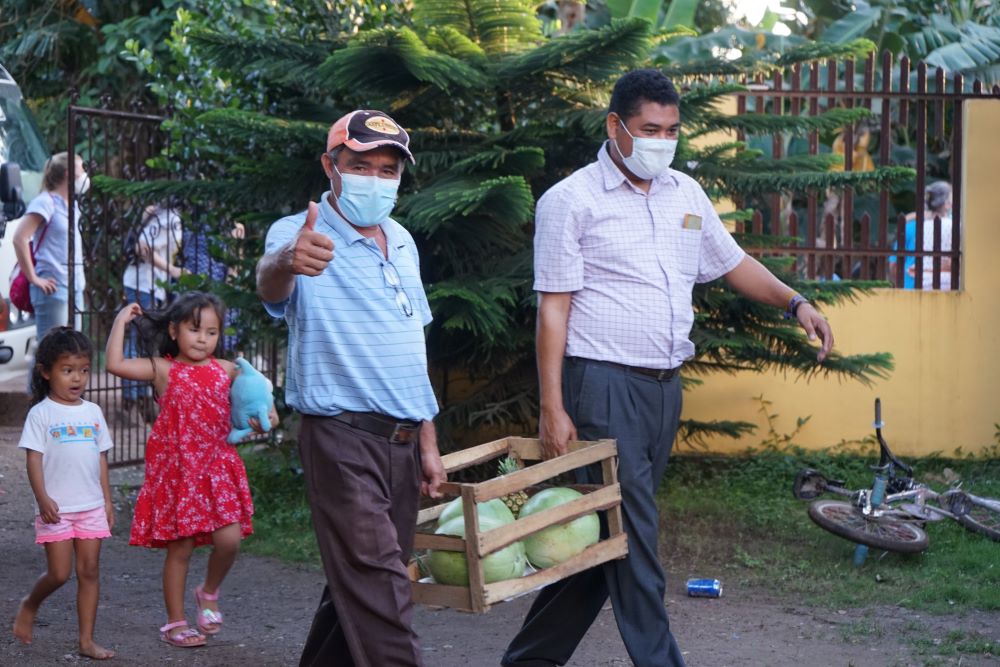 Reynaldo Dominguez, a Guapinol community leader, walks with Leonel George, a member of Tocoa City Council. (SHARE Foundation/Mark Coplan)