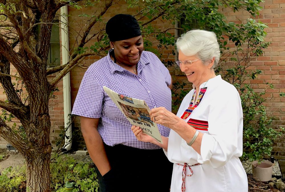 St. Joseph Sr. Dianne Fanguy (right) and St. Joseph Associate Monique Harper look at a news story that says a more stringent environmental review by the Army Corps of Engineers will delay a proposed plastics complex. (Courtesy of Dianne Fanguy)