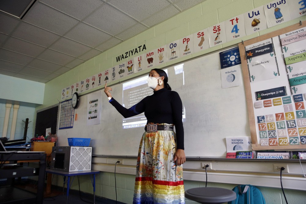 Multi-immersion teacher Randilynn Boucher-Giago leads a lesson on boarding school history Sept. 29, 2021, in Pine Ridge, S.D. (AP/Emily Leshner)