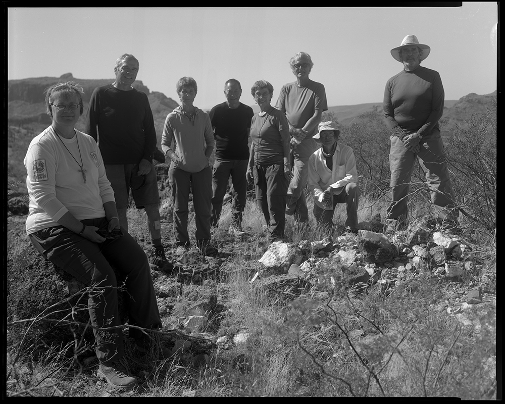 A group of Ajo Samaritans and volunteers pause for a moment before returning to Ajo town after spending half a day dropping off water and food for migrants in the Sonoran Desert of Arizona.