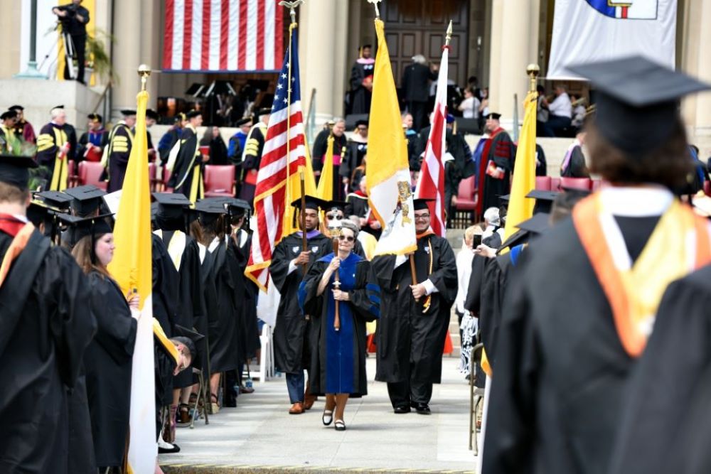 Catholic University of America students and faculty celebrate graduation May 12, 2018. (CNS/The Catholic University of America/Dana Rene Bowler)