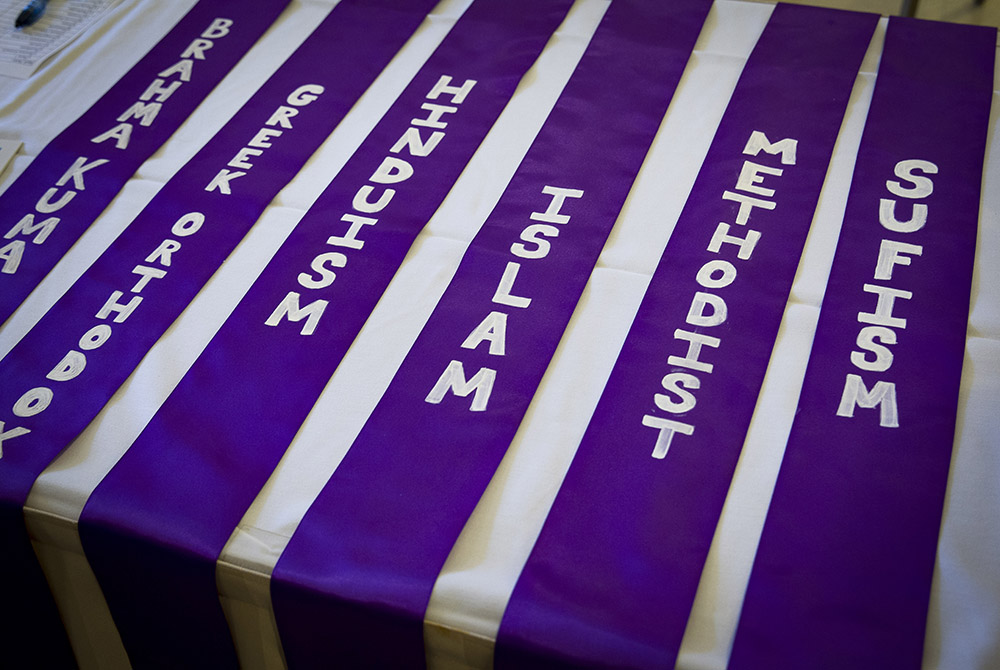 The names of different religions are lined up near a registration table for the annual Unity Walk Sept. 21, 2014, in Washington. (CNS/Tyler Orburn)