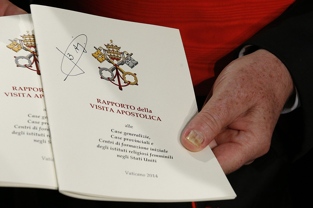 The final report of a Vatican-ordered investigation of U.S. communities of women religious is seen a December 2014 Vatican press conference. (CNS/Paul Haring)