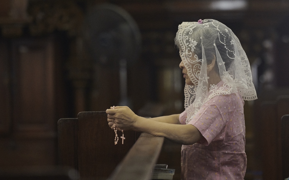 A woman prays at St. Mary's Cathedral in Yangon, Myanmar, Oct. 15. (CNS/Paul Jeffery)