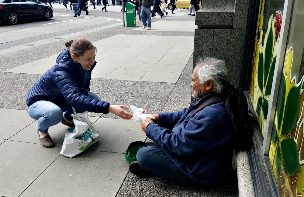 A volunteer with Catholic Street Missionaries interacts with a homeless man in early April 2017 in Vancouver, British Columbia. (CNS/Courtesy of Catholic Street Missionaries)