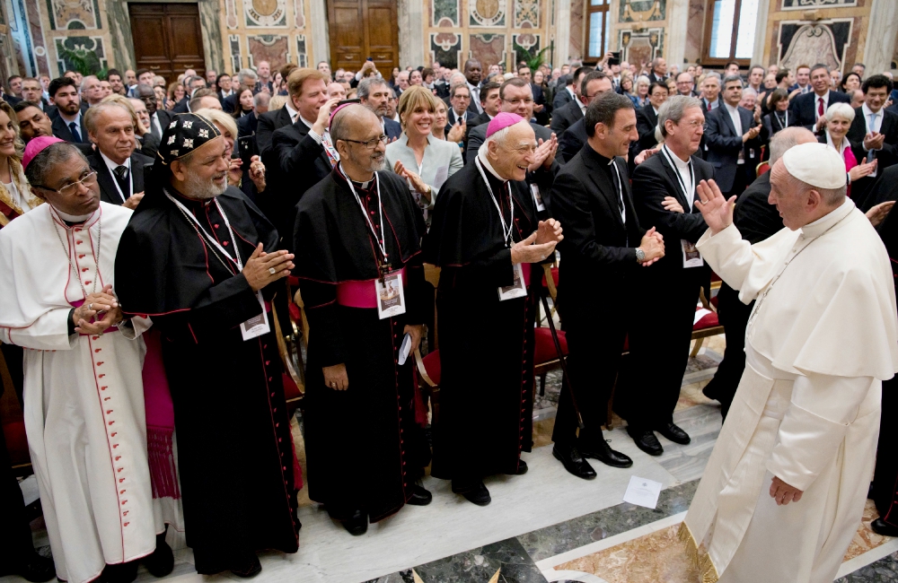 Pope Francis greets attendees at a conference on building a world free of nuclear weapons, at the Vatican Nov. 10. (CNS/L'Osservatore Romano)