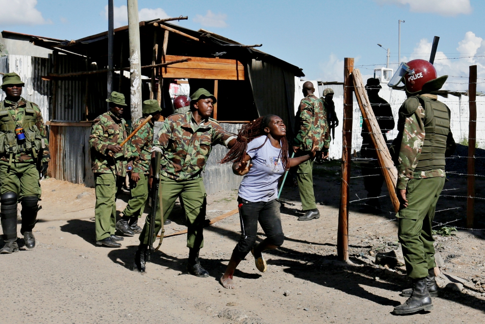 A police officer pushes a supporter of the Kenyan National Super Alliance during clashes Nov. 28, 2017, in Nairobi. (CNS/Reuters/Thomas Mukoya)