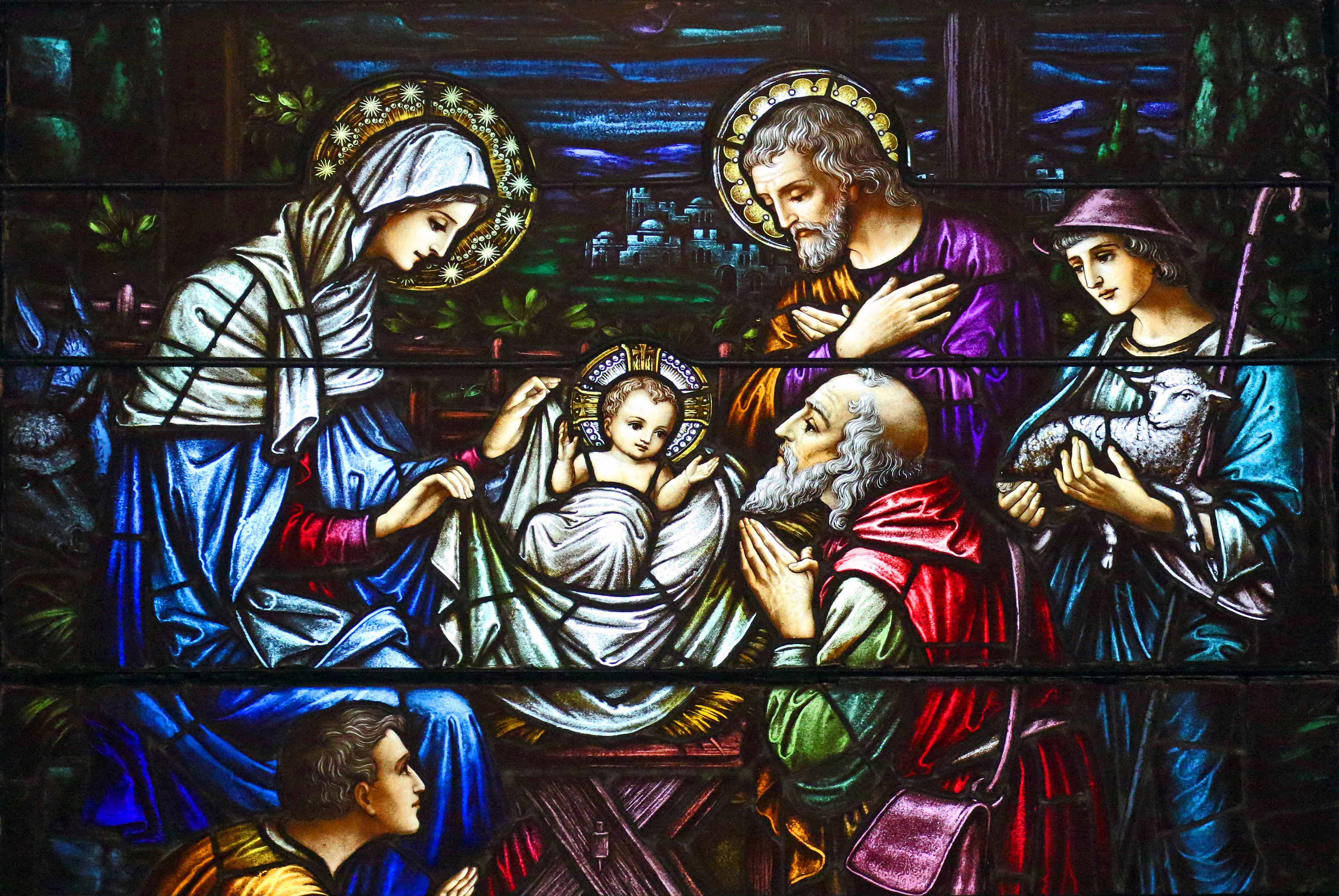 This stained-glass window at St. Aloysius Church in Great Neck, N.Y., depicts Jesus in a manger surrounded by Mary, Joseph and three shepherds. (CNS/Gregory A. Shemitz) This stained-glass window at St. Aloysius Church in Great Neck, N.Y., depicts Jesus in a manger surrounded by Mary, Joseph and three shepherds. (CNS/Gregory A. Shemitz)
