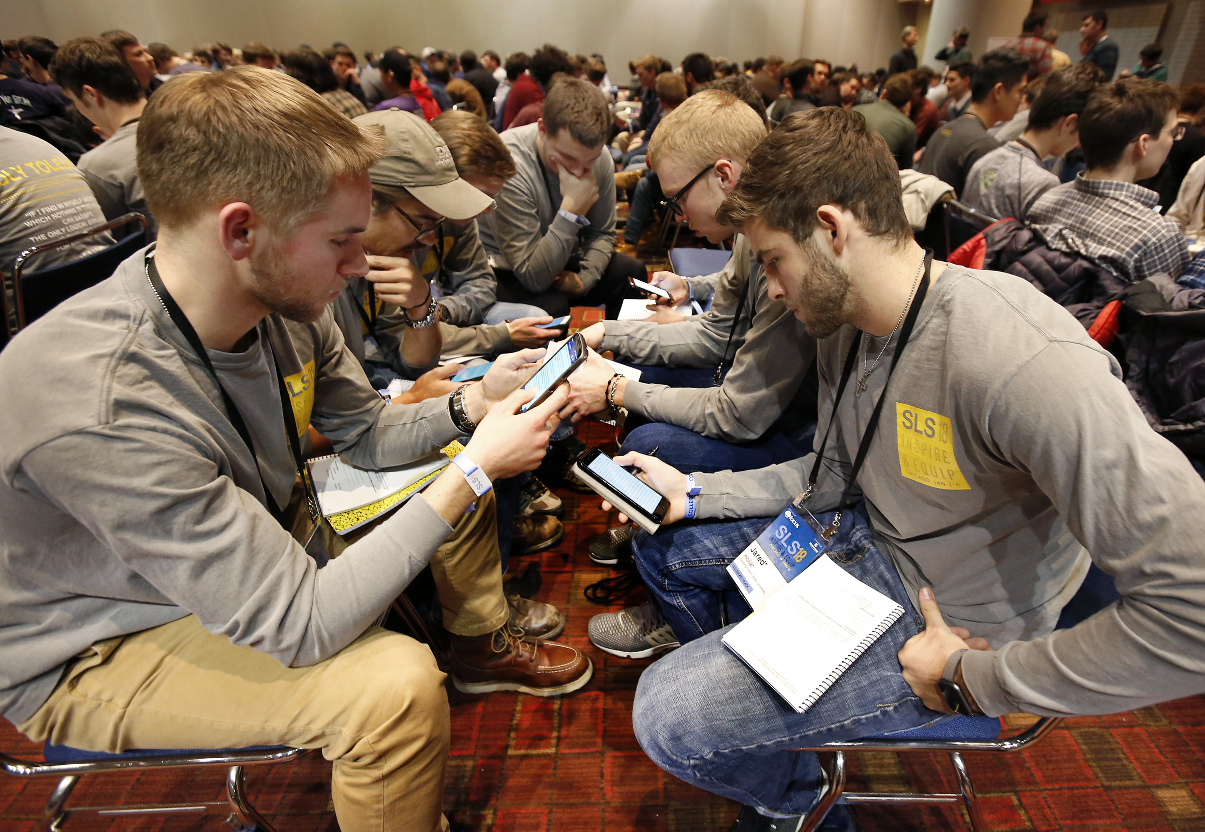 Students from the Diocese of Toledo, Ohio, look up Scripture passages on their cellphones during a group discussion Jan. 3 at a conference sponsored by the Fellowship of Catholic University Students in Chicago. (CNS/Karen Callaway, Chicago Catholic) Students from the Diocese of Toledo, Ohio, look up Scripture passages on their cellphones during a group discussion Jan. 3 at a conference sponsored by the Fellowship of Catholic University Students in Chicago. (CNS/Karen Callaway, Chicago Catholic)