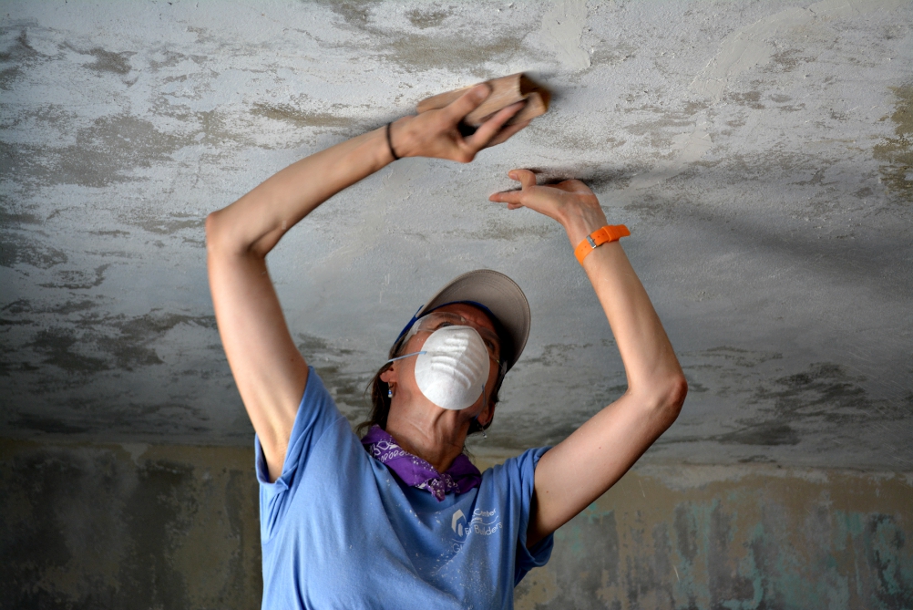 Beth Hood, a member of St. Camillus Parish in Silver Spring, Maryland, helps repair a house in Maunabo, Puerto Rico, July 27. (CNS/Wallice J. de la Vega)