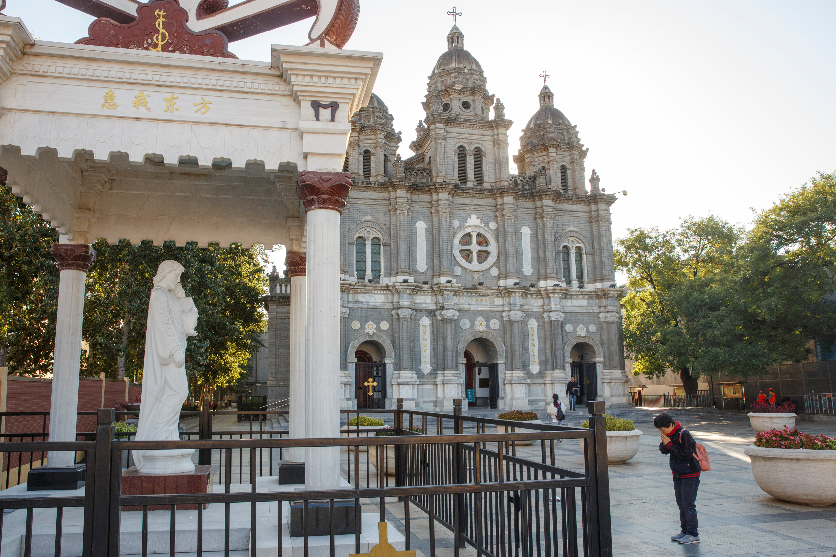 A woman prays Oct. 1 outside St. Joseph Catholic Church in Beijing. (CNS/Isaac Brekken, EPA) A woman prays Oct. 1 outside St. Joseph Catholic Church in Beijing. (CNS/Isaac Brekken, EPA)