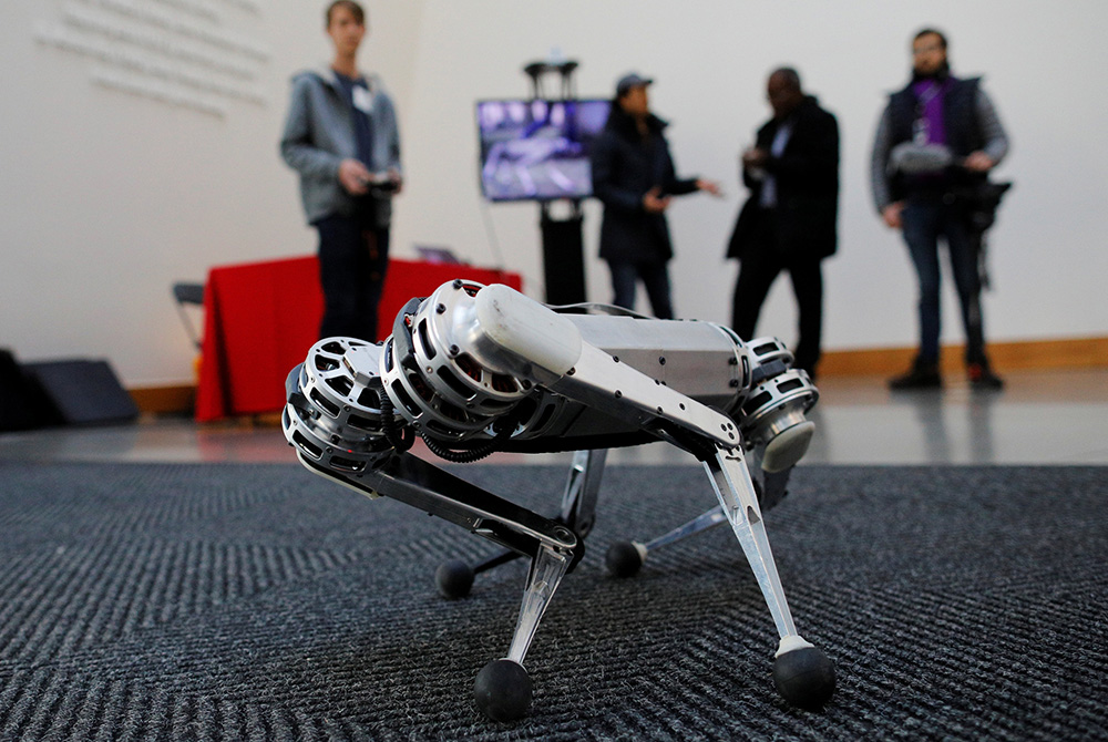 Students demonstrate the Mini Cheetah, a quadruped robot, during presentations at the Massachusetts Institute of Technology Feb. 26, 2019, in Cambridge. In his book "Robots, Ethics and the Future of Jobs," Fr. Seán McDonagh predicts that millions of jobs 