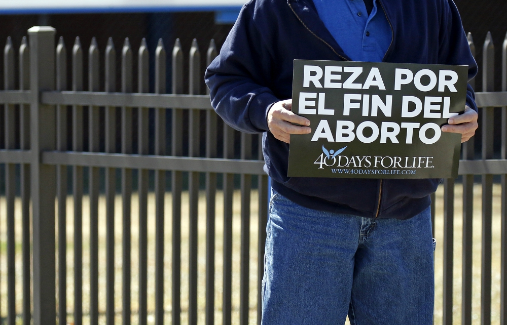 A Spanish-language sign that reads, "Pray for the end of abortion," is seen at a vigil near the entrance to a Planned Parenthood center in Smithtown, New York, March 26. (CNS/Gregory A. Shemitz) A Spanish-language sign that reads, "Pray for the end of abortion," is seen at a vigil near the entrance to a Planned Parenthood center in Smithtown, New York, March 26. (CNS/Gregory A. Shemitz)