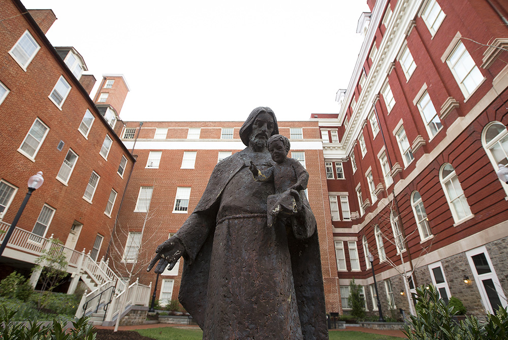Mulledy Hall, also known as Freedom Hall, center, is seen April 4, 2017, on the campus of Georgetown University. The building has been renamed after Isaac Hawkins, the first enslaved person listed in the Jesuit university's documents on its selling of sla Mulledy Hall, also known as Freedom Hall, center, is seen April 4, 2017, on the campus of Georgetown University. The building has been renamed after Isaac Hawkins, the first enslaved person listed in the Jesuit university's documents on its selling of sla