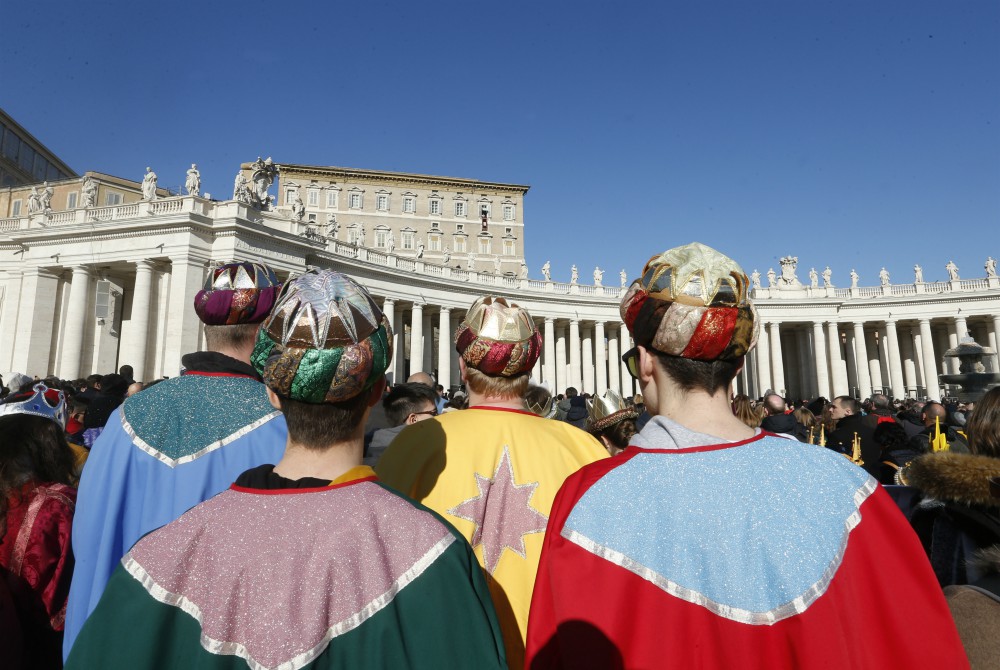 Children dressed as the Magi attend the Angelus led by Pope Francis from the window of his studio overlooking St. Peter's Square at the Vatican Jan. 1. (CNS/Paul Haring) Children dressed as the Magi attend the Angelus led by Pope Francis from the window of his studio overlooking St. Peter's Square at the Vatican Jan. 1. (CNS/Paul Haring)