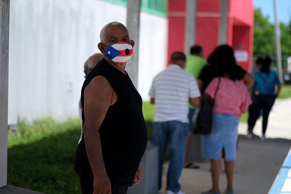 A voter in Loiza, Puerto Rico, waits to cast his ballot Aug. 16, 2020. (CNS/Reuters/Ricardo Arduengo) A voter in Loiza, Puerto Rico, waits to cast his ballot Aug. 16, 2020. (CNS/Reuters/Ricardo Arduengo)