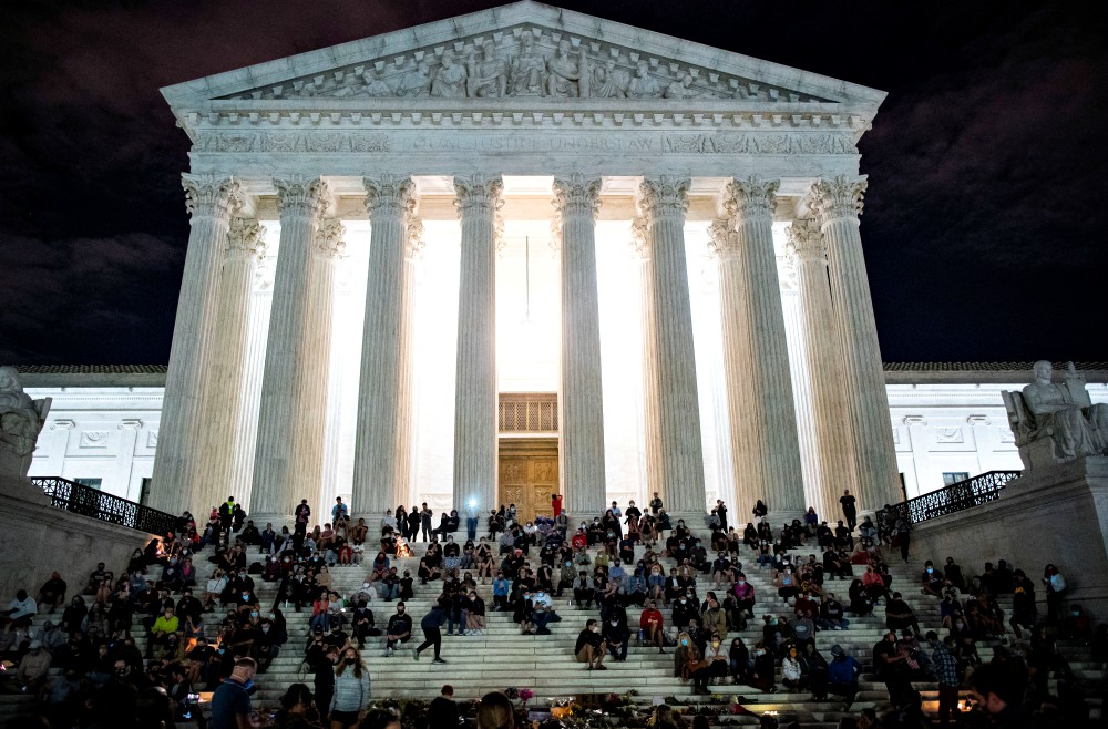 People in Washington gather in front of the U.S. Supreme Court following the death of U.S. Supreme Court Justice Ruth Bader Ginsburg Sept. 18. (CNS/Reuters/Al Drago)