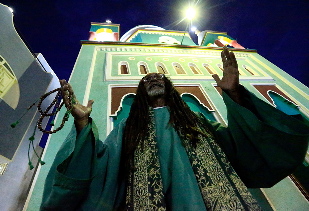 A Muslim man is pictured in a file photo praying outside a mosque in Khartoum, Sudan. (CNS/Reuters/Mohamed Nureldin Abdallah)