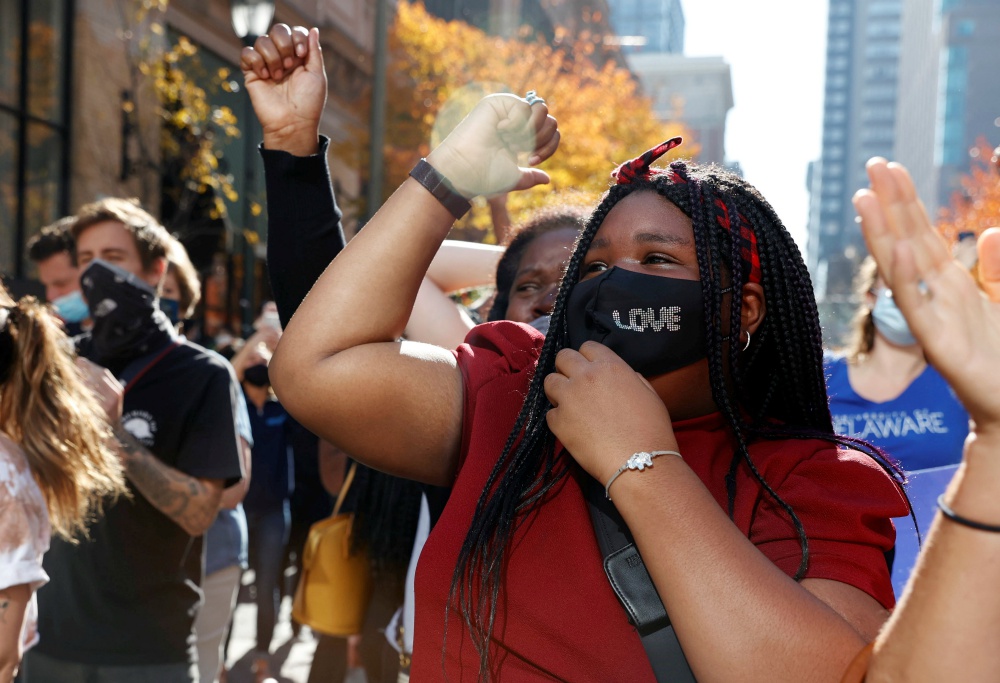 People react in Philadelphia Nov. 7 as media announces that Democratic U.S. presidential nominee Joe Biden is the projected winner of the 2020 presidential election. (CNS/Reuters/Rachel Wisniewski)