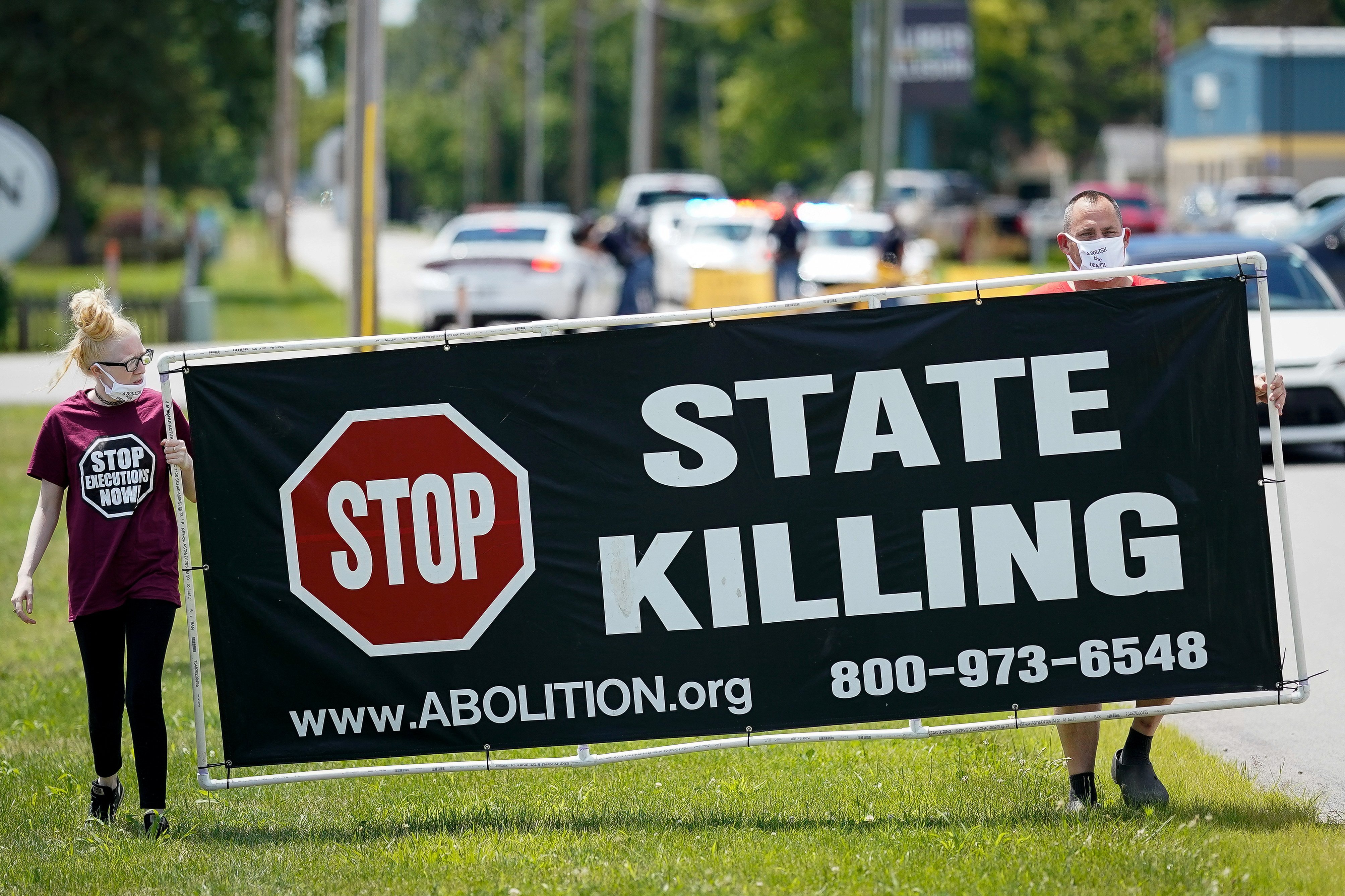 Demonstrators are seen near the Federal Correctional Complex in Terre Haute, Ind., showing their opposition to the death penalty July 13, 2020. (CNS photo/Bryan Woolston, Reuters)