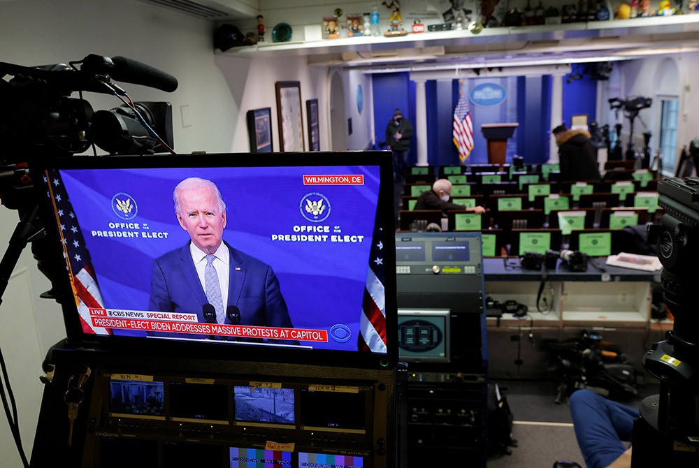 President-elect Joe Biden is seen on a monitor in the White House Briefing Room Jan. 6, making remarks regarding the supporters of President Donald Trump, who breached security barriers at the U.S. Capitol building in Washington and interrupted the certif