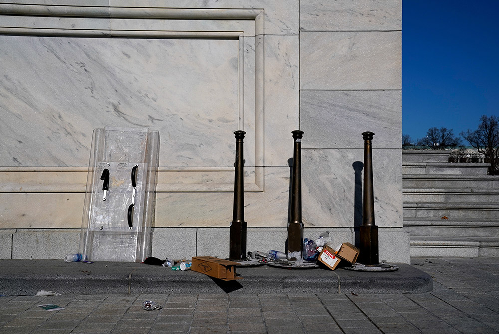 Riot shields lean on a U.S. Capitol wall Jan. 7 in Washington, one day after supporters of President Donald Trump breached the U.S. Capitol. (CNS/Erin Scott, Reuters) Riot shields lean on a U.S. Capitol wall Jan. 7 in Washington, one day after supporters of President Donald Trump breached the U.S. Capitol. (CNS/Erin Scott, Reuters)