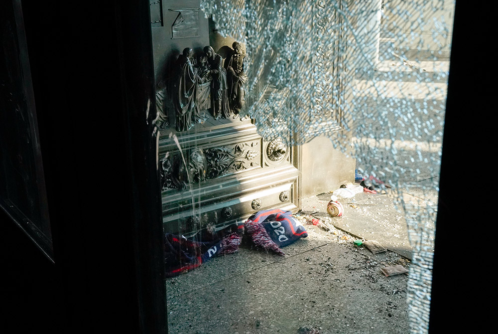 Debris is seen through a smashed glass door Jan. 7 at the U.S. Capitol in Washington, D.C., one day after supporters of President Donald Trump stormed Capitol Hill. (CNS/Reuters/Erin Scott)