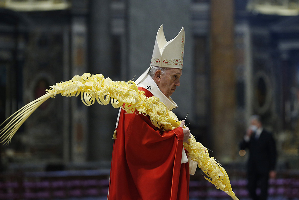 Pope Francis carries palm fronds in procession as he celebrates Palm Sunday Mass in St. Peter's Basilica March 28 at the Vatican. (CNS/Paul Haring) Pope Francis carries palm fronds in procession as he celebrates Palm Sunday Mass in St. Peter's Basilica March 28 at the Vatican. (CNS/Paul Haring)