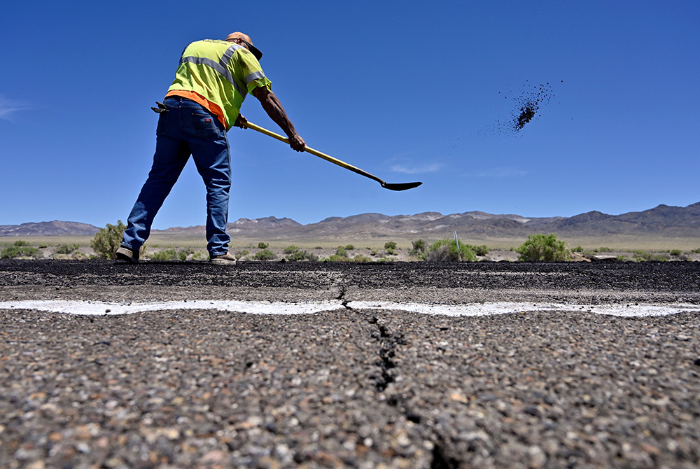 A Nevada Department of Transportation worker repairs damage to Highway 95 near Tonopah, Nevada, May 15, 2020. President Joe Biden's American Jobs Plan calls for investing more than $2 trillion over the next decade in upgrading the nation's roads, bridges, A Nevada Department of Transportation worker repairs damage to Highway 95 near Tonopah, Nevada, May 15, 2020. President Joe Biden's American Jobs Plan calls for investing more than $2 trillion over the next decade in upgrading the nation's roads, bridges,