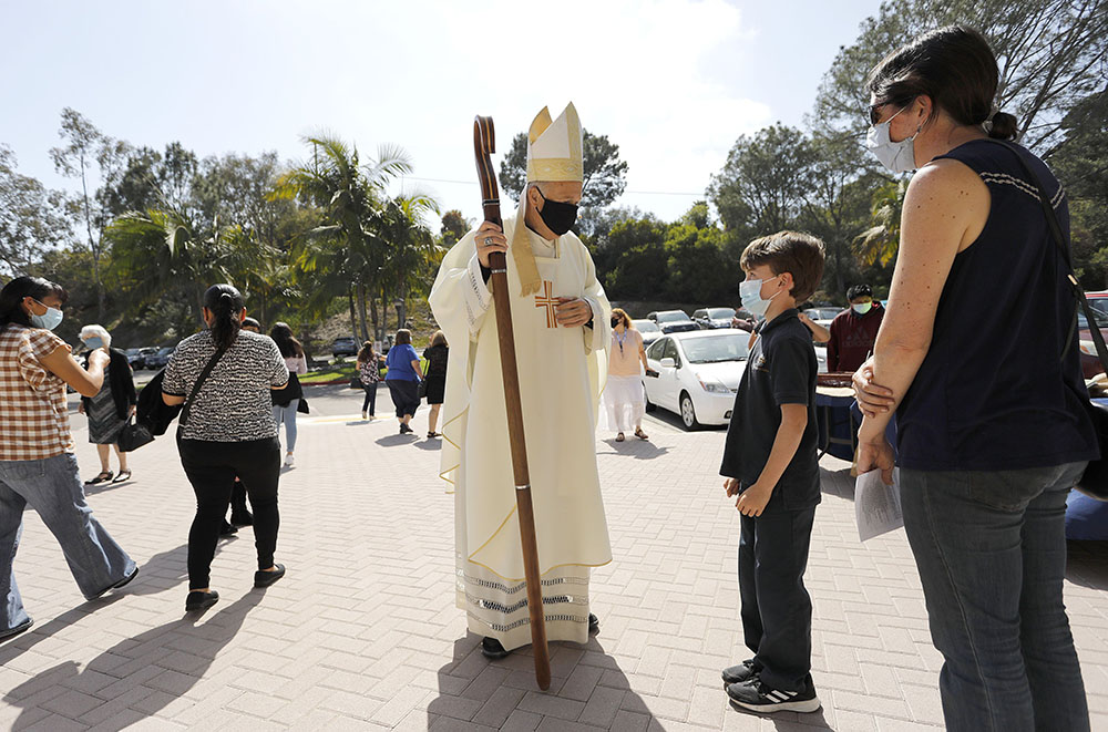 San Diego Bishop Robert McElroy greets parishioners at St. James Church in Solana Beach, California, April 17, after celebrating a bilingual Mass for Earth Week, observed April 16-25. (CNS/The Southern Cross/John Gastaldo) San Diego Bishop Robert McElroy greets parishioners at St. James Church in Solana Beach, California, April 17, after celebrating a bilingual Mass for Earth Week, observed April 16-25. (CNS/The Southern Cross/John Gastaldo)