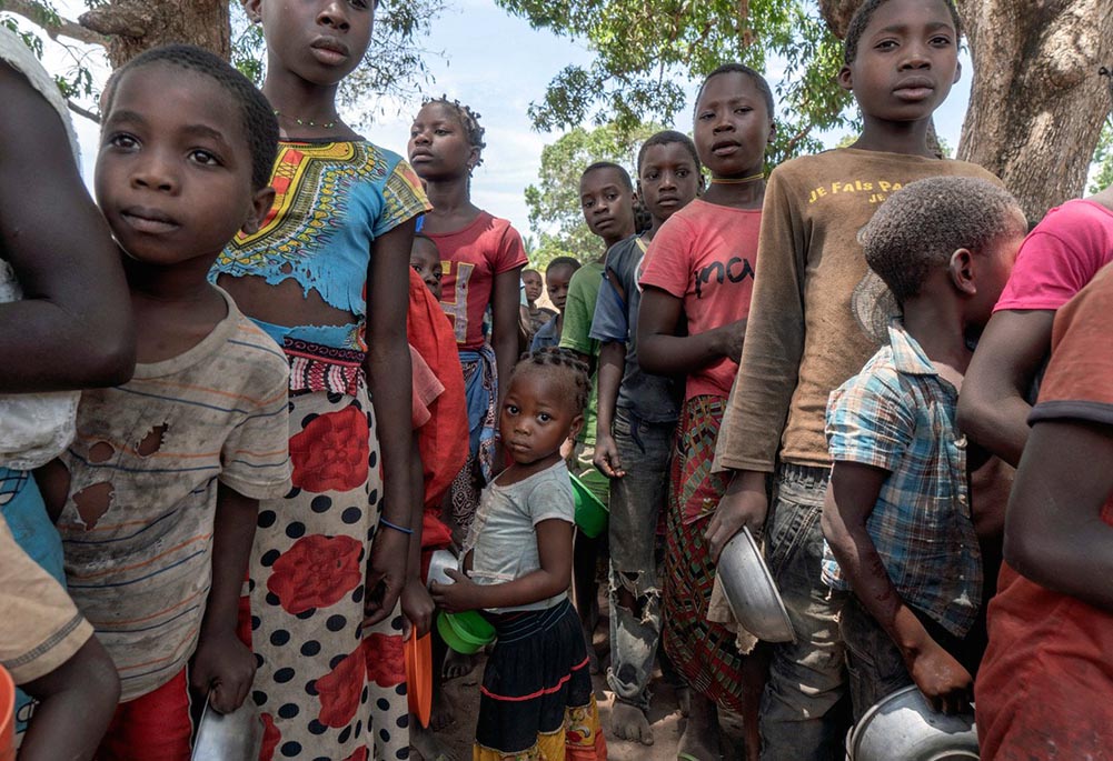 Displaced Mozambicans gather in a camp in the country's Cabo Delgado province in this 2019 photo. Residents in northern Mozambique have been grappling with an Islamist insurgency since 2017. (CNS/Courtesy of AVSI/Alessandro Grassani)