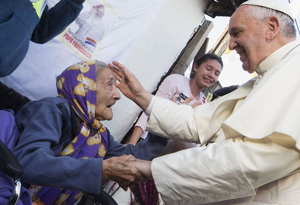 Pope Francis greets an elderly woman as he meets with people in Asunción, Paraguay, on July 12, 2015. (CNS/Paul Haring)