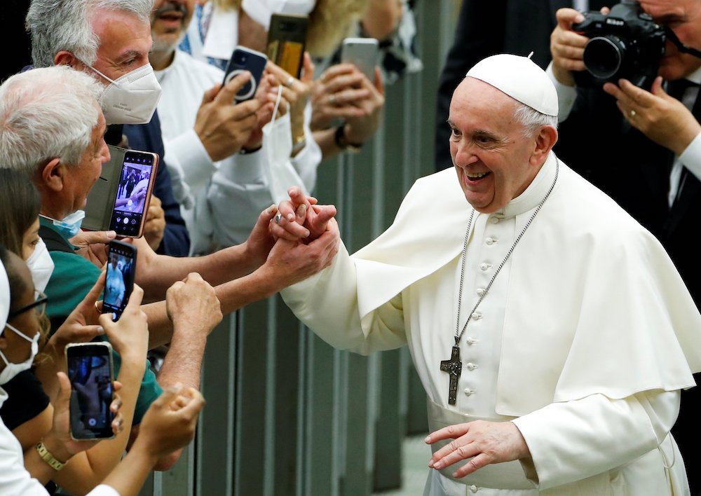 Pope Francis greets people during an event marking the 50th anniversary of the founding of Caritas Italy, at the Vatican June 26. (CNS/Reuters/Remo Casilli)