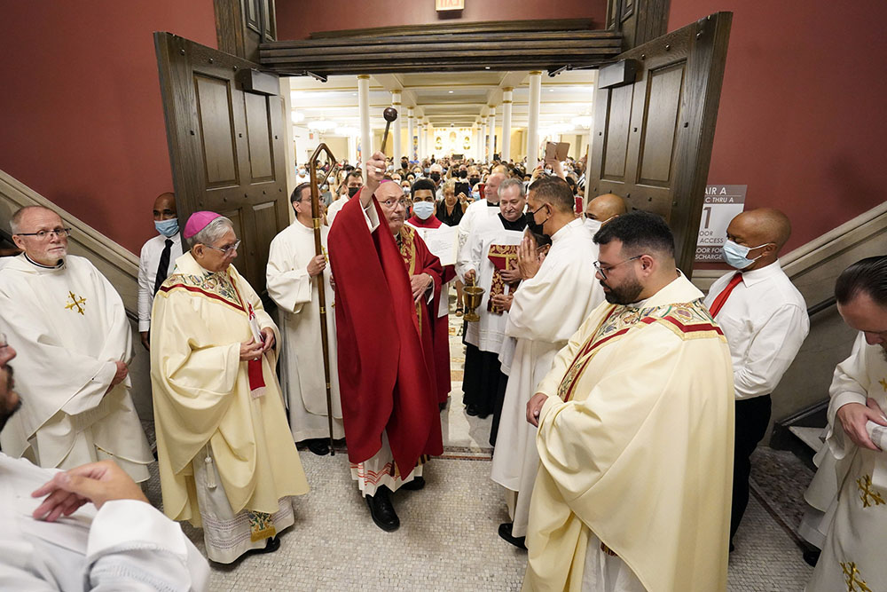 Bishop Nicholas DiMarzio of Brooklyn, New York, uses holy water during the dedication of Sts. Peter & Paul Church in Brooklyn June 29, the feast of Sts. Peter and Paul. (CNS/Gregory A. Shemitz) Bishop Nicholas DiMarzio of Brooklyn, New York, uses holy water during the dedication of Sts. Peter & Paul Church in Brooklyn June 29, the feast of Sts. Peter and Paul. (CNS/Gregory A. Shemitz)