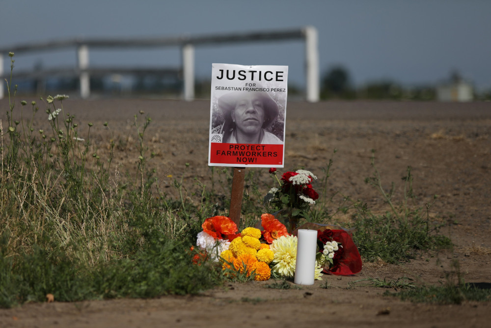 A makeshift memorial is seen in St. Paul, Ore., July 3, 2021, where Guatemalan-born farmworker Sebastian Francisco Perez died during the heat wave a week earlier while moving field irrigation lines. (CNS/Reuters/Alisha Jucevic)