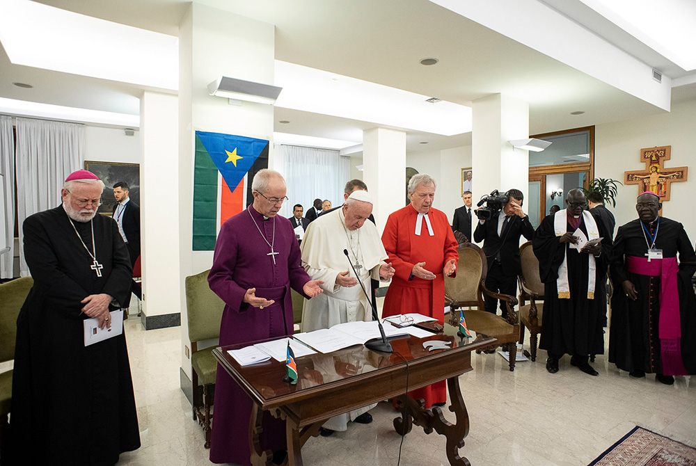 Pope Francis prays alongside Archbishop Paul Gallagher, the Vatican's foreign minister, Anglican Archbishop Justin Welby of Canterbury, and the Rev. John Chalmers, former moderator of the Presbyterian Church of Scotland, April 11, 2019, at the conclusion Pope Francis prays alongside Archbishop Paul Gallagher, the Vatican's foreign minister, Anglican Archbishop Justin Welby of Canterbury, and the Rev. John Chalmers, former moderator of the Presbyterian Church of Scotland, April 11, 2019, at the conclusion