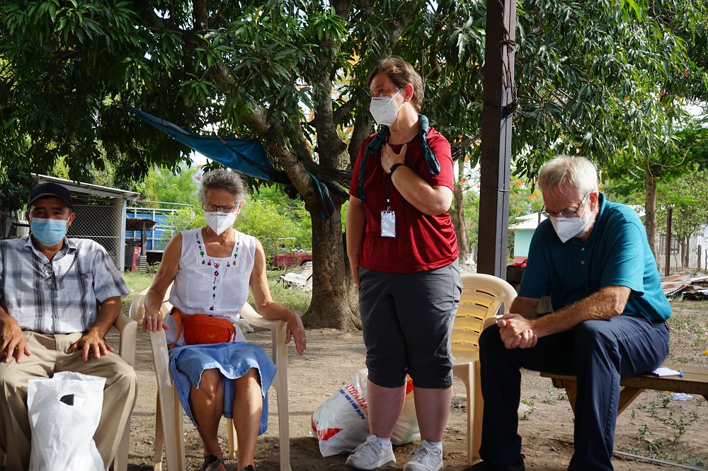 Mercy Sr. Mary Kay Dobrovolny, standing, speaks with a delegation from the U.S. in Honduras in early July. In the solidarity trip, the U.S. visitors learned about conditions that fuel northward migration. (CNS/Courtesy of SHARE)