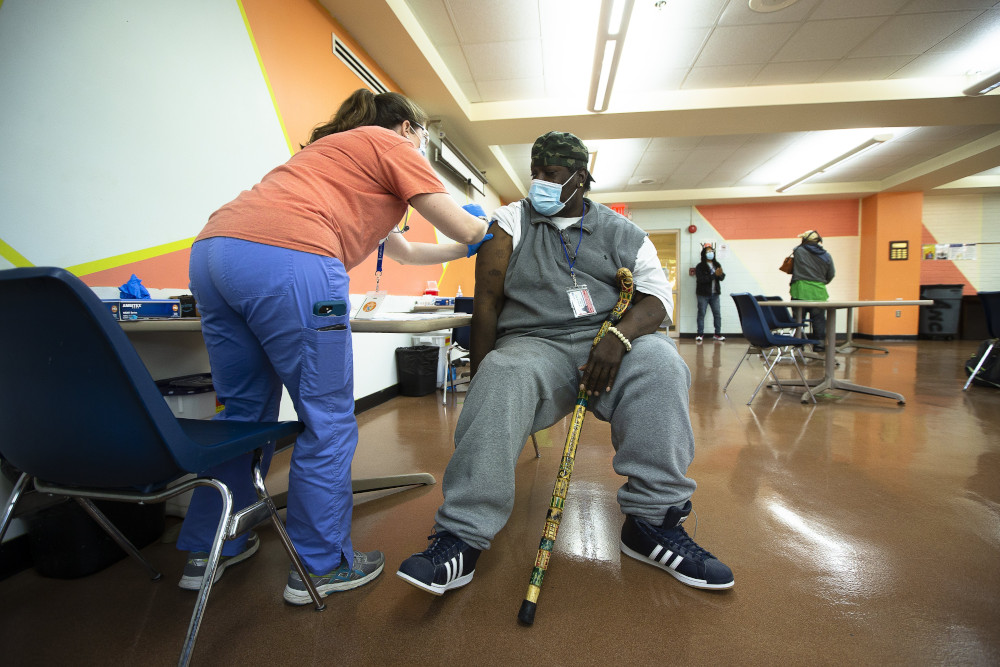 A man at Catholic Charities in the Brookland neighborhood of Washington receives the Johnson & Johnson COVID-19 vaccine May 18 at a pop-up clinic. (CNS/Tyler Orsburn)