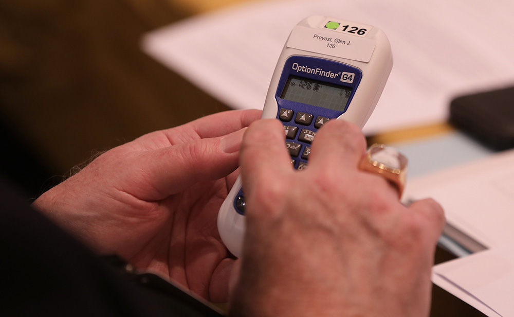 A bishop casts his vote during a Nov. 16, 2021, session of the fall general assembly of the U.S. Conference of Catholic Bishops in Baltimore. (CNS/Bob Roller)