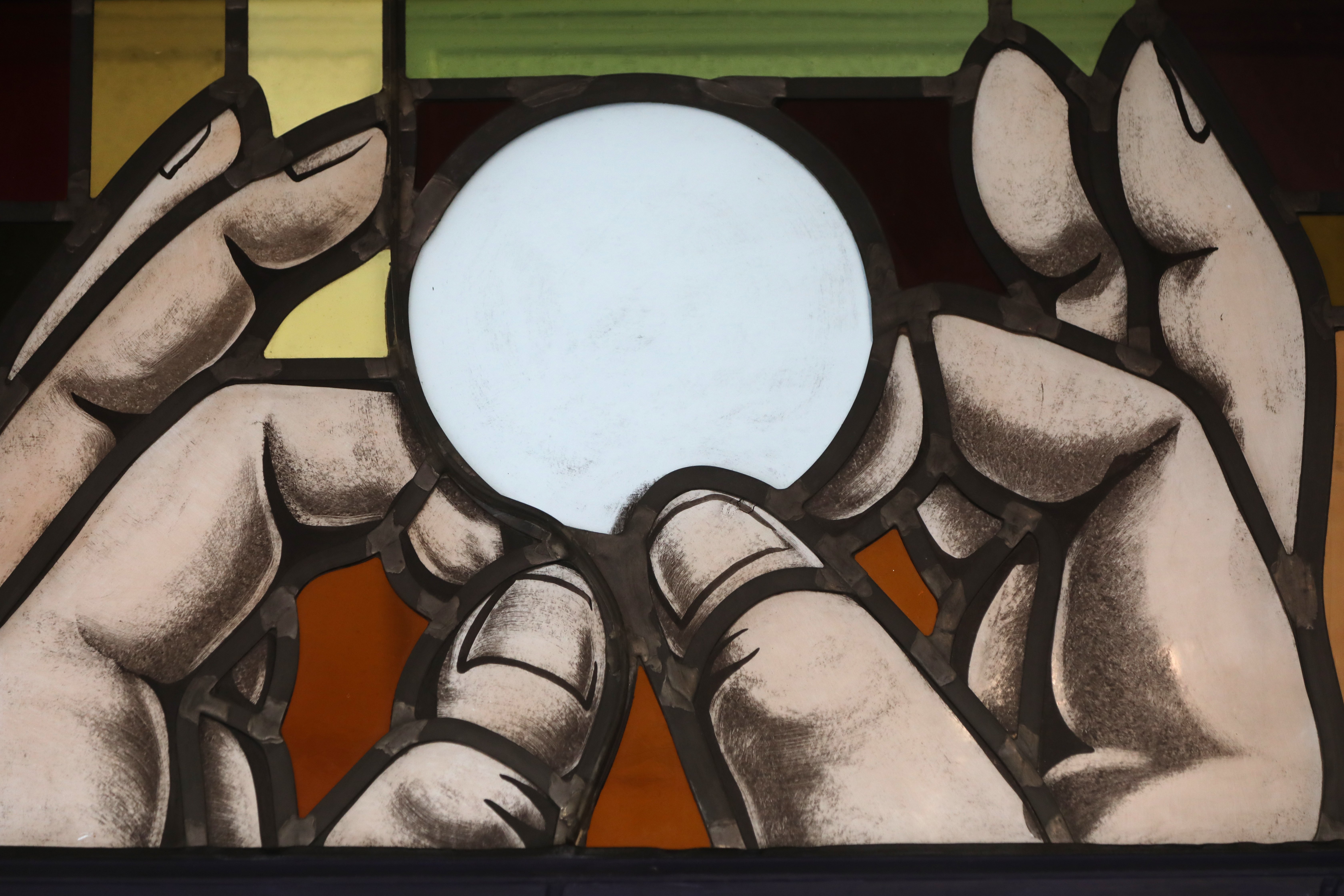 Elevation of the Eucharist is depicted in a stained-glass window at St. Anthony's Church in North Beach, Md., July 15, 2021. (CNS photo/Bob Roller)