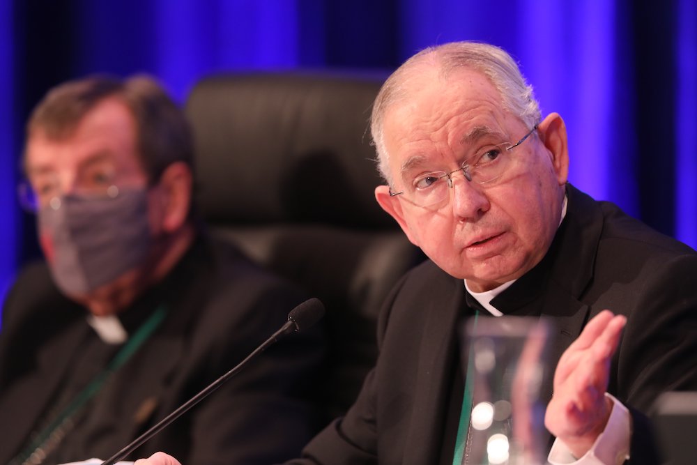 Archbishop José Gomez of Los Angeles, president of the U.S. Conference of Catholic Bishops, gestures alongside Detroit Archbishop Allen Vigneron, vice president, during a Nov. 17 session of the bishops' fall general assembly in Baltimore. (CNS/Bob Roller)