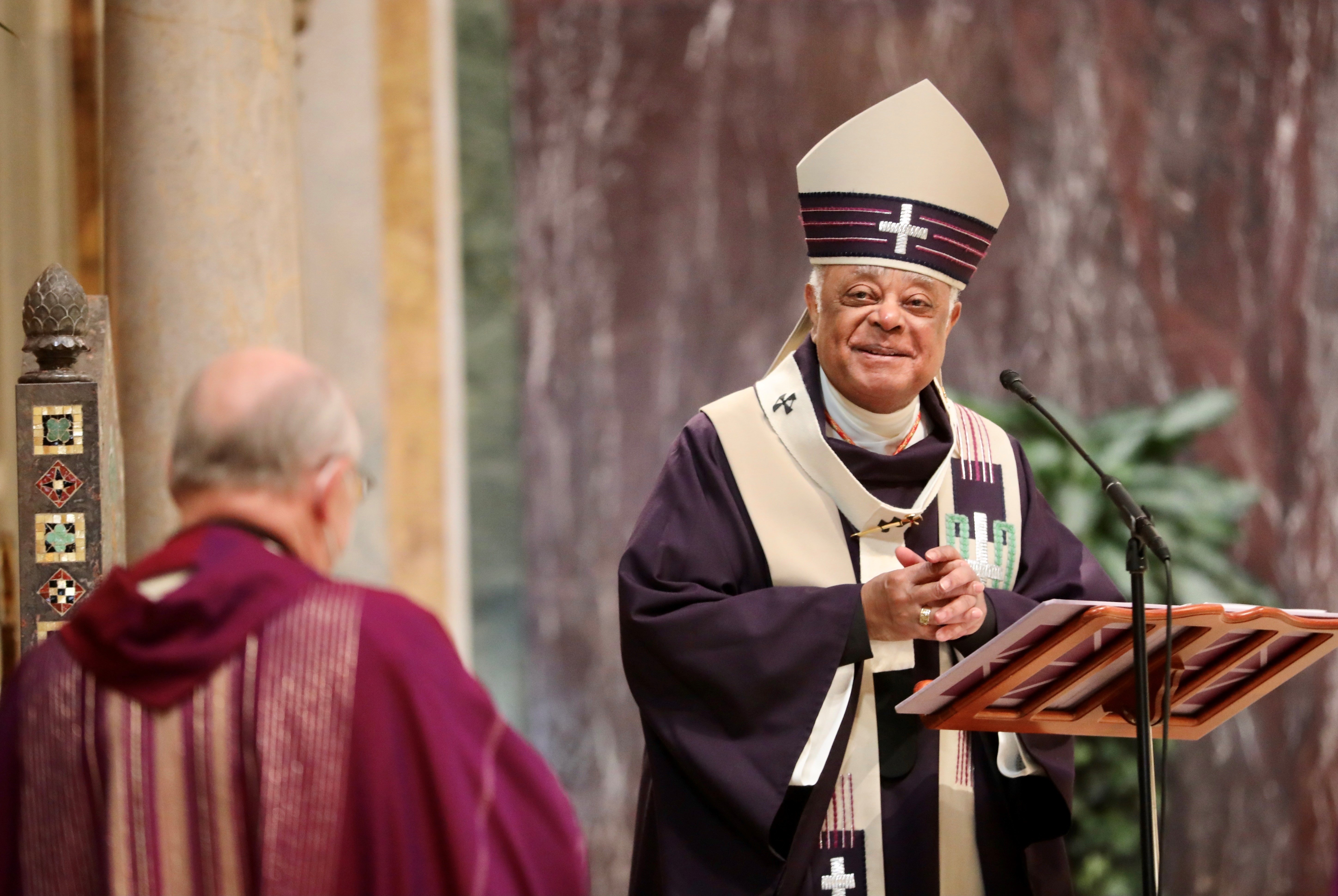 Washington Cardinal Wilton D. Gregory is congratulated after Mass Nov. 28, 2021, by Msgr. W. Ronald Jameson, rector at the Cathedral of St. Matthew. (CNS photo/Andrew Biraj, Catholic Standard)