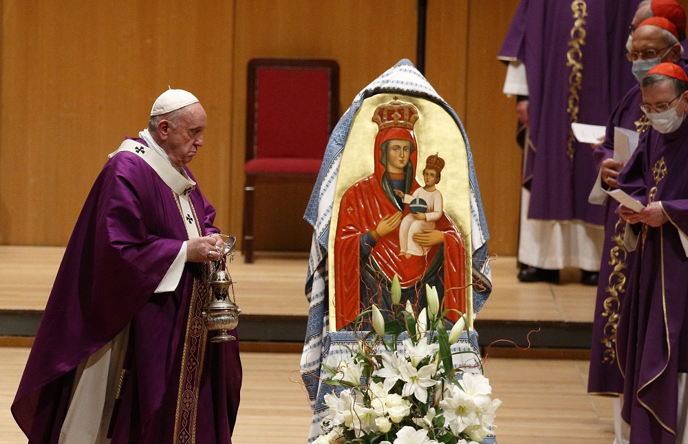 Pope Francis uses incense to venerate a Marian image as he celebrates Mass in the Megaron Concert Hall in Athens, Greece, Dec. 5, 2021