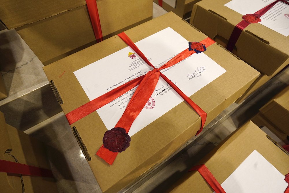 Sealed archival boxes containing documents related to Dorothy Day's canonization cause are seen in the sanctuary following a Mass Dec. 8, at St. Patrick's Cathedral in New York City. (CNS/Gregory A. Shemitz)