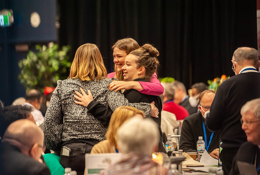 Women embrace on the final day of the second assembly of the Plenary Council of the Australian Catholic church in Sydney July 8. (CNS/The Catholic Weekly/Giovanni Portelli)