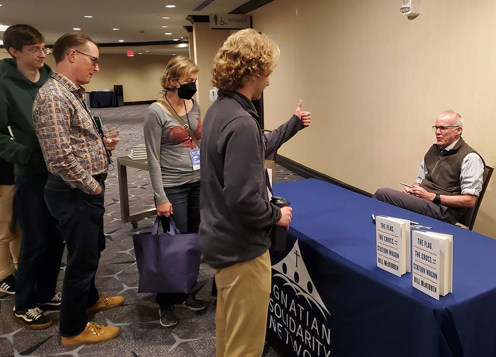 Attendees of the 25th annual Ignatian Family Teach-In for Justice line up to meet environmental activist and writer Bill McKibben Oct. 22 in Washington, D.C. (EarthBeat photo/Brian Roewe)