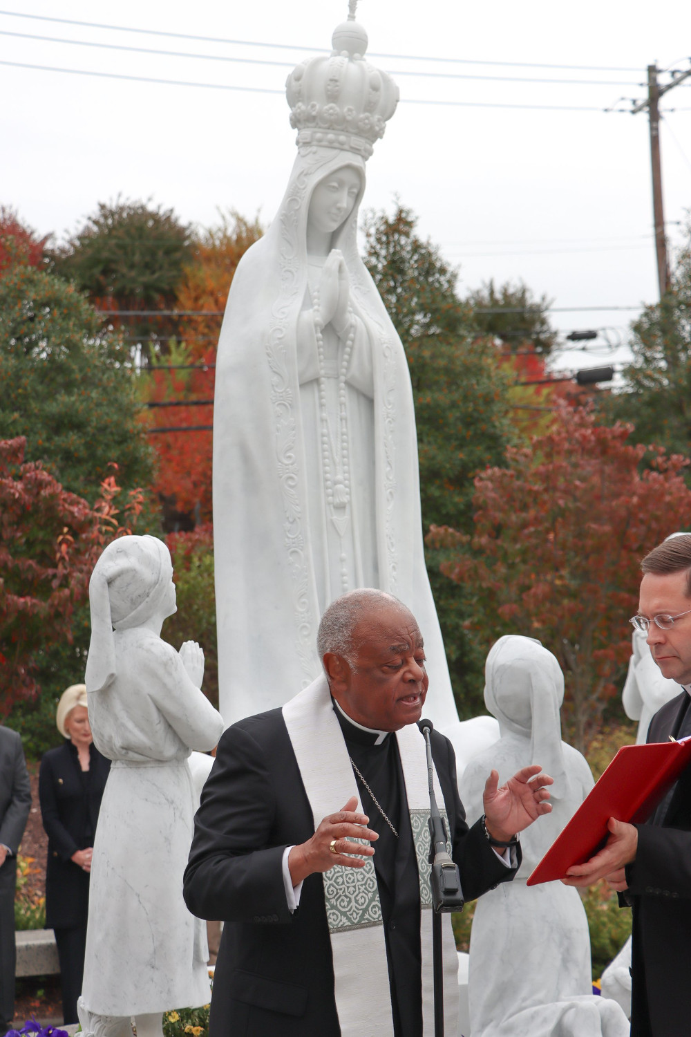 Washington Cardinal Wilton D. Gregory blesses a new statue of Our Lady of Fatima at the Rosary Walk and Garden outside the Basilica of the National Shrine of the Immaculate Conception Oct. 23, 2022.