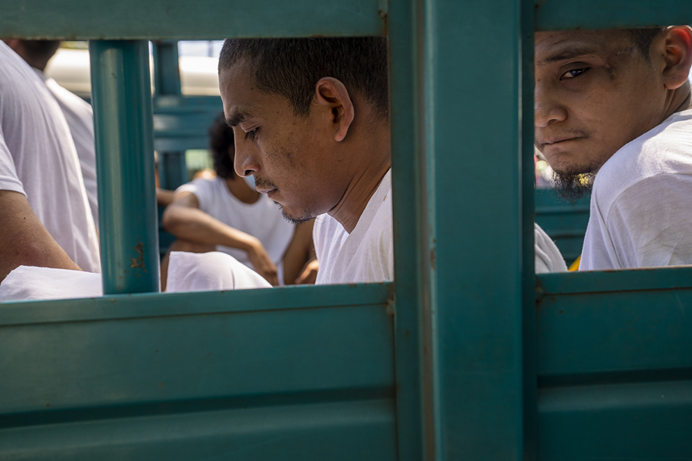 Men who were detained by the police are brought to a detention center in Soyapango, El Salvador, Oct. 12, during the "state of exception" the government has declared in a crackdown on gangs. (AP/Moises Castillo)