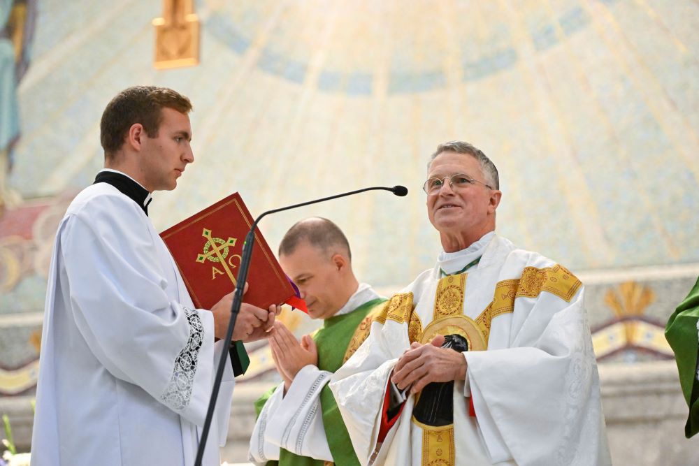 Archbishop Timothy Broglio of the U.S. Archdiocese for the Military Services greets a U.S. Naval Academy cadet midshipman after the annual Sea Services Pilgrimage Mass at the National Shrine of St. Elizabeth Ann Seton in Emmitsburg, Md., Oct. 2, 2022. (CNS/Jason Minick, courtesy of Devine Partners)